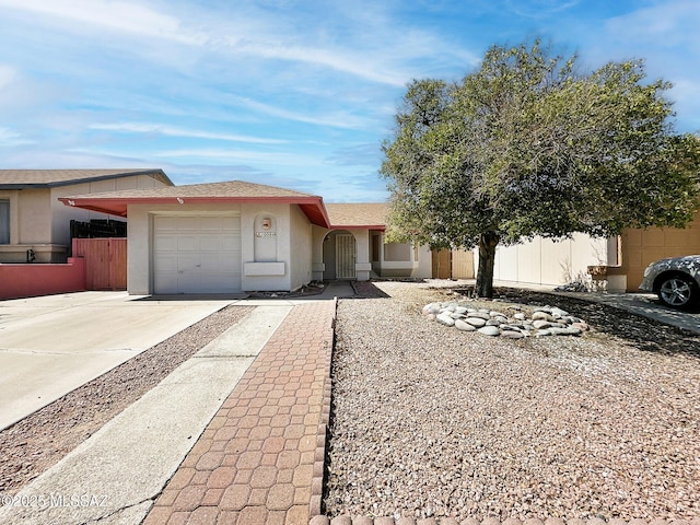 10084 E Bryonwood Ln, Tucson, AZ 85730 - ranch-style house featuring a garage, stucco siding, and driveway
