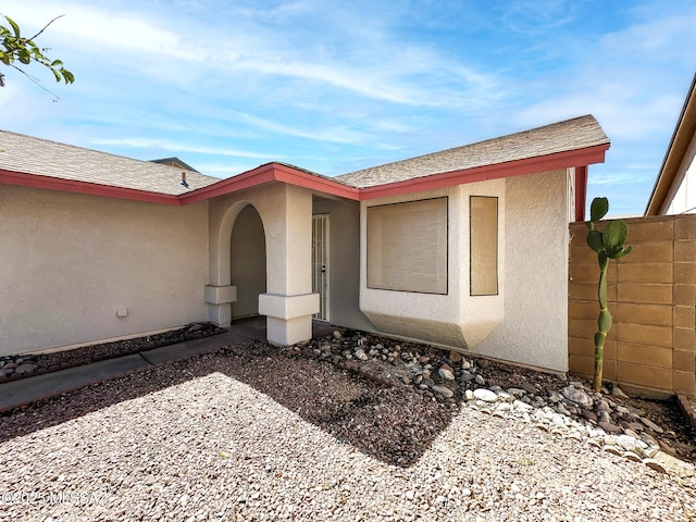 10084 E Bryonwood Ln, Tucson, AZ 85730 - property entrance featuring stucco siding and roof with shingles