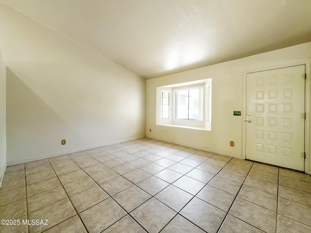 10084 E Bryonwood Ln, Tucson, AZ 85730 - entryway with light tile patterned floors and baseboards