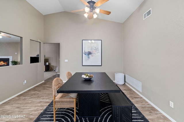 dining space with a ceiling fan, light wood-style flooring, and visible vents