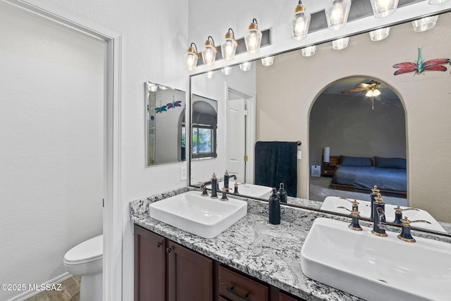 9696 E Paseo, San Rosendo, Tucson, AZ 85747 - full bathroom with a sink, toilet, and ensuite bath