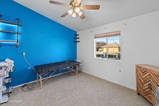 sitting room with carpet floors, a ceiling fan, and lofted ceiling