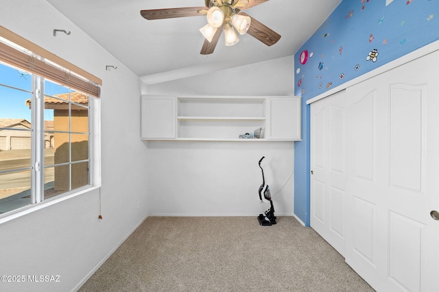 laundry room featuring carpet floors, baseboards, and a ceiling fan