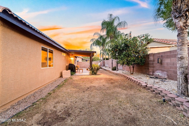 view of yard with a fenced backyard and a patio