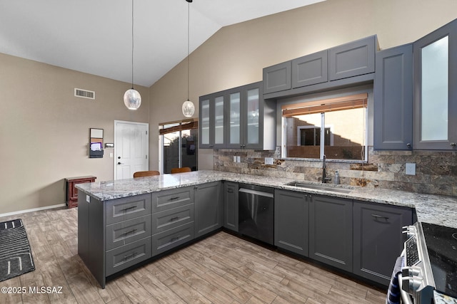 9696 E Paseo, San Rosendo, Tucson, AZ 85747 - kitchen with decorative backsplash, appliances with stainless steel finishes, a sink, gray cabinetry, and a peninsula