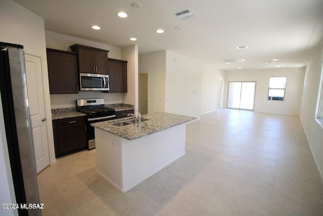 kitchen featuring visible vents, dark brown cabinets, recessed lighting, a sink, and appliances with stainless steel finishes