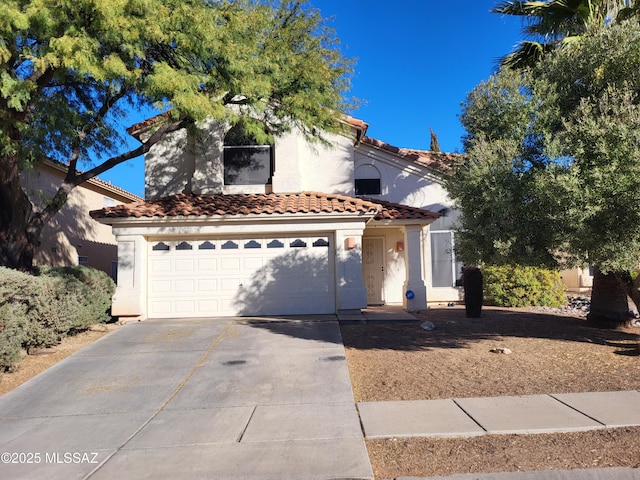 10161 E Queensgate Way, Tucson, AZ 85748 - mediterranean / spanish-style house featuring an attached garage, stucco siding, driveway, and a tile roof