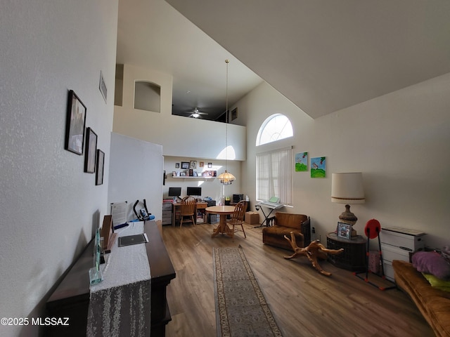 10161 E Queensgate Way, Tucson, AZ 85748 - living room featuring ceiling fan, high vaulted ceiling, visible vents, and wood finished floors
