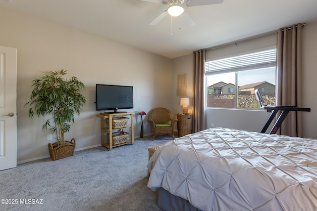 carpeted bedroom featuring baseboards and ceiling fan