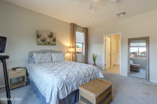 carpeted bedroom featuring baseboards, ceiling fan, and visible vents