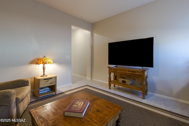 living room featuring baseboards