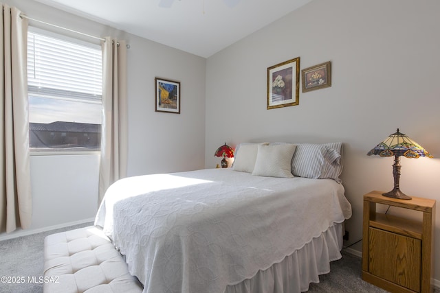 bedroom with baseboards, carpet flooring, and ceiling fan