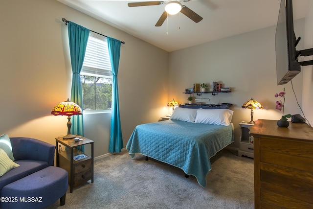 carpeted bedroom featuring baseboards and ceiling fan