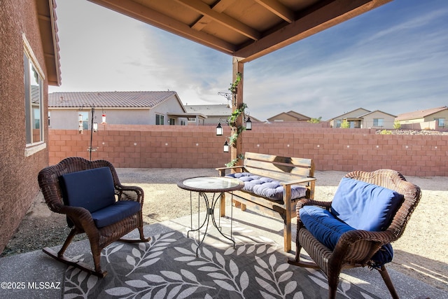 view of patio / terrace featuring a fenced backyard and an outdoor living space