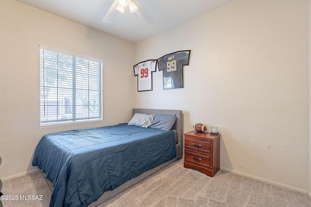 bedroom with carpet floors, baseboards, and ceiling fan