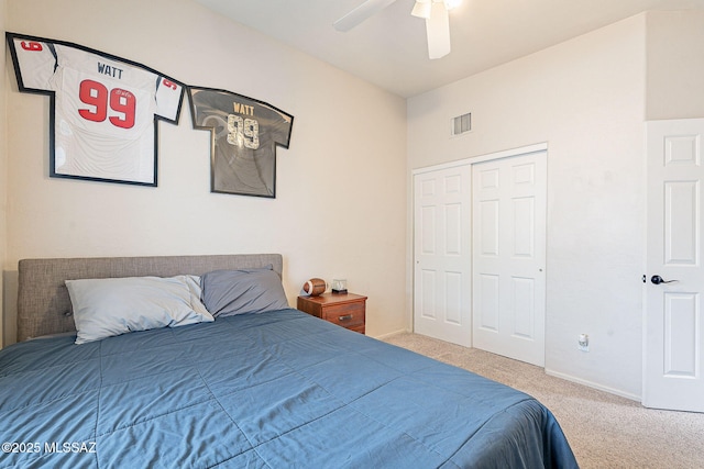 carpeted bedroom featuring a closet, a ceiling fan, baseboards, and visible vents