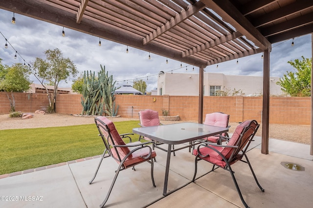 view of patio featuring outdoor dining area, a fenced backyard, and a pergola