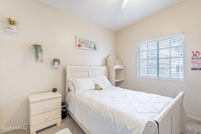 bedroom with baseboards, light colored carpet, and ceiling fan