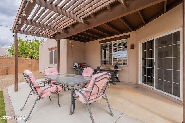 view of patio / terrace with fence, a pergola, outdoor dining area, and grilling area