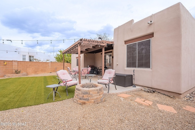 view of patio featuring an outdoor fire pit, fence, and a pergola