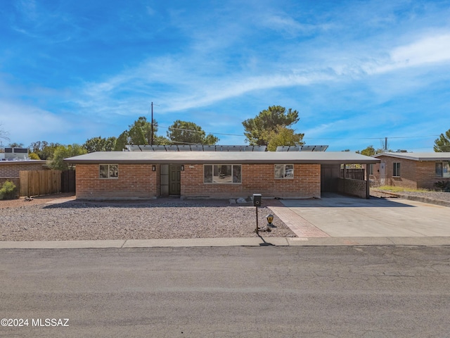 4362 E Ln Cienega St, Tucson, AZ 85712 - ranch-style home featuring concrete driveway, brick siding, fence, and an attached carport