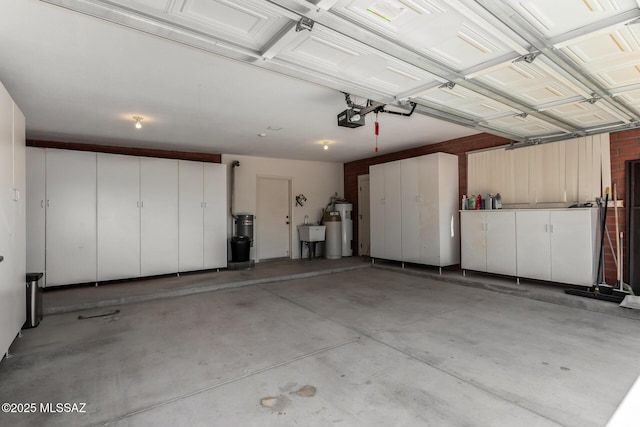 garage featuring a sink and a garage door opener