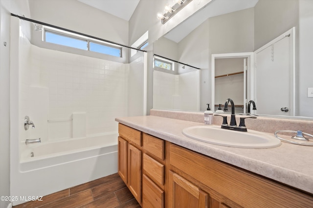 full bathroom with shower / tub combination, wood finished floors, and vanity