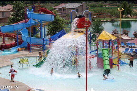 view of jungle gym with a water play area