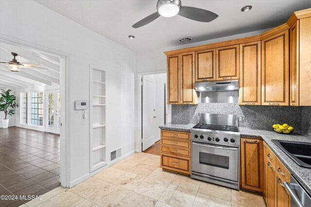 3263 E Broadway Blvd, Tucson, AZ 85716 - kitchen with backsplash, appliances with stainless steel finishes, under cabinet range hood, and ceiling fan