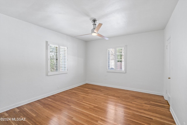 3263 E Broadway Blvd, Tucson, AZ 85716 - unfurnished room featuring a ceiling fan, baseboards, and light wood-type flooring