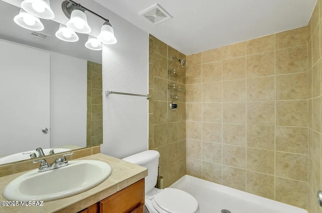 bathroom featuring a shower stall, toilet, and visible vents