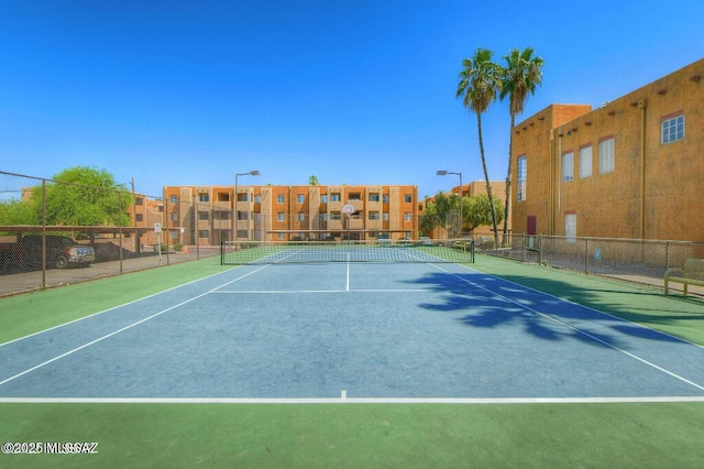 view of sport court with fence