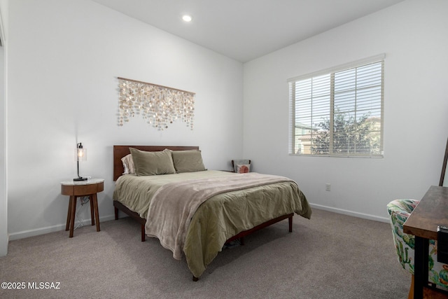 carpeted bedroom featuring baseboards and recessed lighting