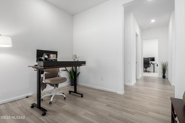 office area featuring light wood-type flooring, baseboards, and recessed lighting