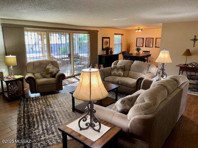 215 E Los Rincones, Green Valley, AZ 85614 - living area featuring a textured ceiling and wood finished floors