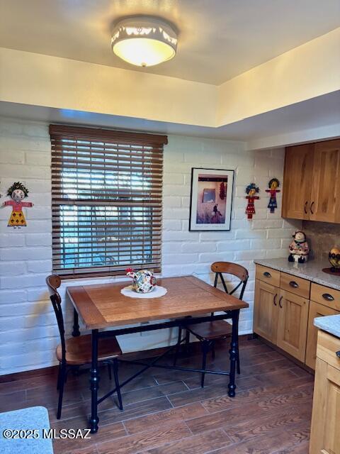 215 E Los Rincones, Green Valley, AZ 85614 - dining space featuring dark wood finished floors