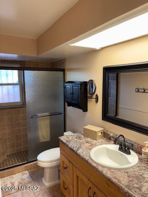 215 E Los Rincones, Green Valley, AZ 85614 - bathroom with vanity, a stall shower, and toilet