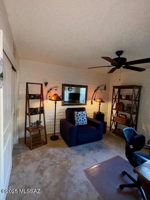 215 E Los Rincones, Green Valley, AZ 85614 - living area featuring carpet floors, a ceiling fan, a textured ceiling, and visible vents