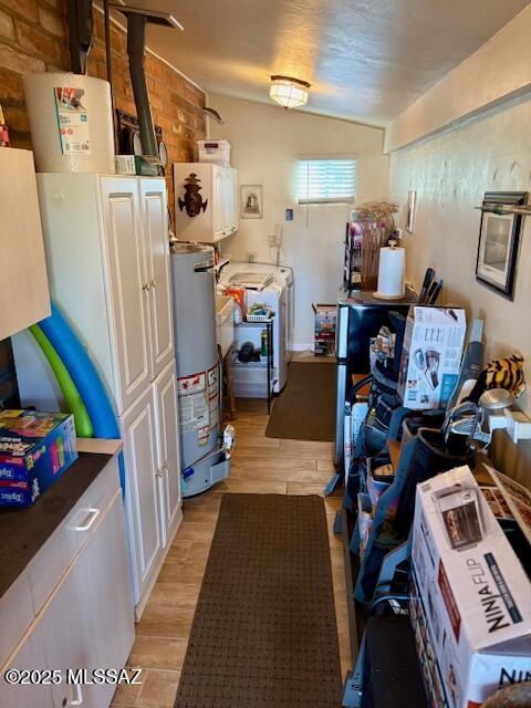 215 E Los Rincones, Green Valley, AZ 85614 - storage room with washer / dryer and gas water heater