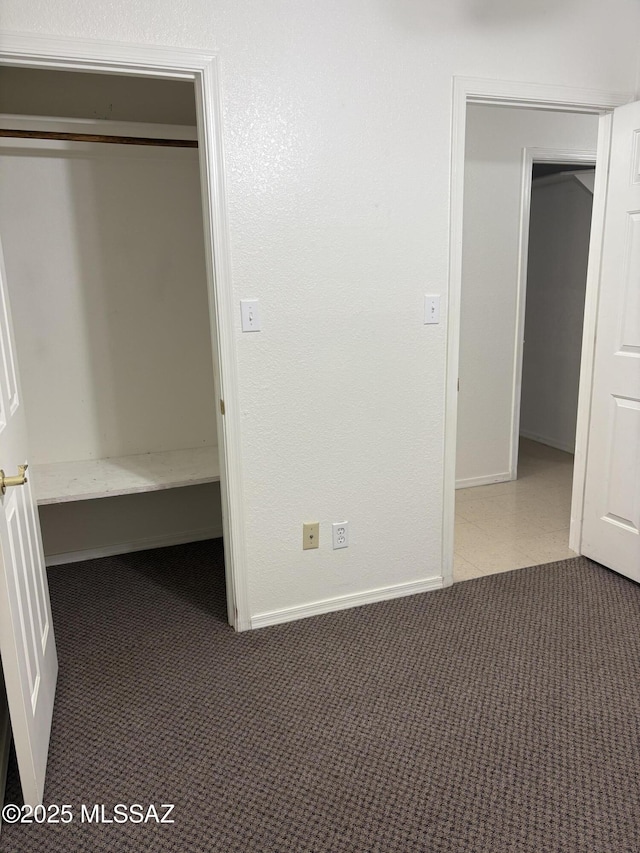 829 E Calle Esplendor, Nogales, AZ 85621 - unfurnished bedroom with baseboards and dark carpet