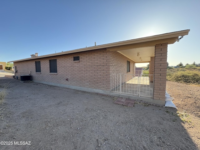 829 E Calle Esplendor, Nogales, AZ 85621 - back of property featuring central AC unit and brick siding