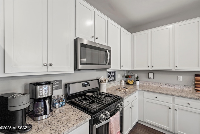 kitchen featuring white cabinets and stainless steel appliances