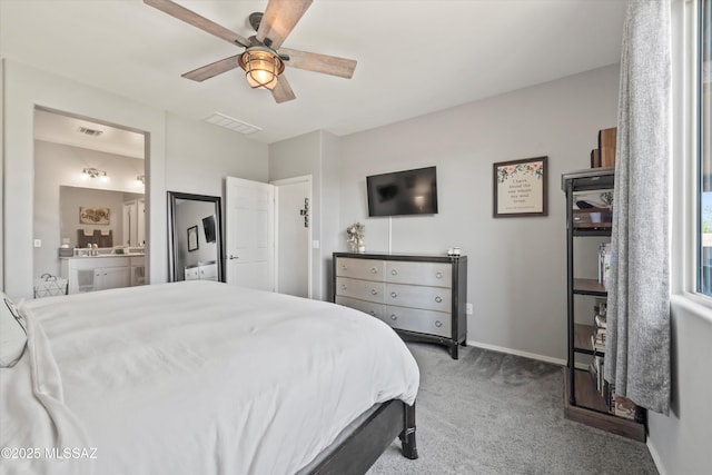 bedroom featuring carpet floors, baseboards, visible vents, and ensuite bathroom