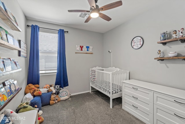 bedroom featuring carpet floors, ceiling fan, a nursery area, and visible vents