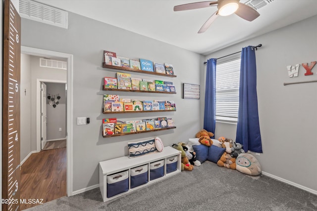 recreation room featuring baseboards, ceiling fan, and visible vents