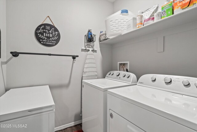 laundry room with laundry area, dark wood-style flooring, and washing machine and clothes dryer
