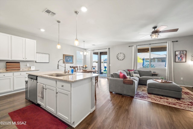 kitchen with a sink, a healthy amount of sunlight, dishwasher, and visible vents