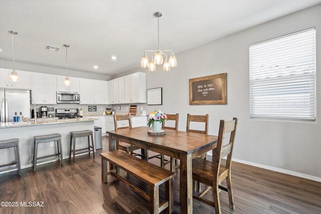 dining room featuring dark wood-style flooring, visible vents, baseboards, a notable chandelier, and recessed lighting