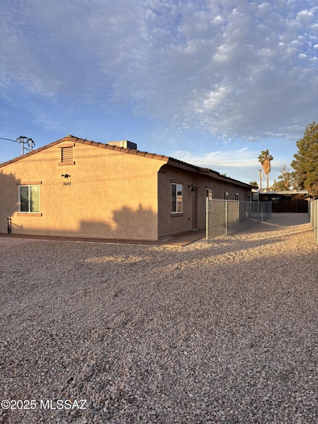 3649 S Belmar Ave, Tucson, AZ 85713 - view of side of home featuring fence and stucco siding