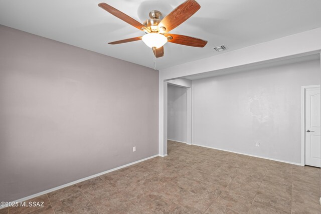 1020 E Wiley Squirrel Ln, Sahuarita, AZ 85629 - unfurnished room featuring visible vents, a ceiling fan, and baseboards